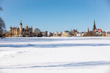 The beautiful, fairy-tale Castle of Schwerin in winter times with theatre and church in winter