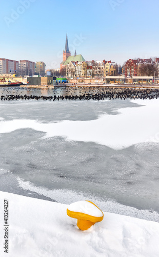 Szczecin waterfront with frozen Odra River in winter, Poland.
