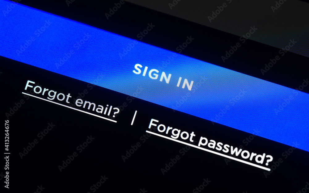 Blue sign in button on LCD screen, login web page, two links for forgotten email and password. Blue sign in button on LCD screen, login web page, two links for forgotten email and password.