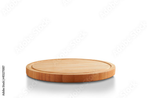 new round wooden cutting board, in top of wooden table with a minimalistic limbo background