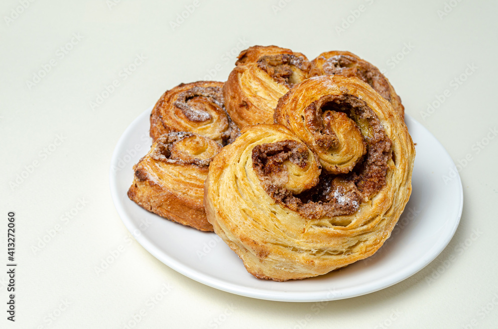 French sweet bun. On a white plate High quality photo
