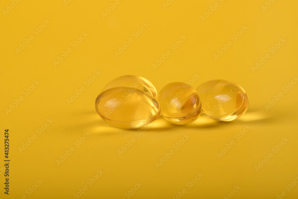 Yellow pills, yellow background. Assorted pharmaceutical medicine pills, tablets and capsules over yellow background. High resolution image for pharmaceutical industry. Yellow pills, yellow background. Assorted pharmaceutical medicine pills, tablets and capsules over yellow background. High resolution image for pharmaceutical industry.