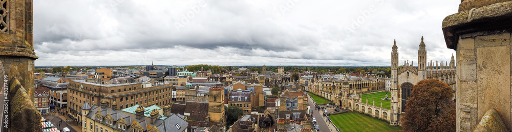 Panorama of the city Cambridge from the observation tower of St.Mary's church in top view with old building in the long cloud.