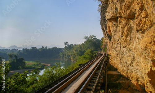 The railway bridge leads to beautiful natural scenery in Thailand.