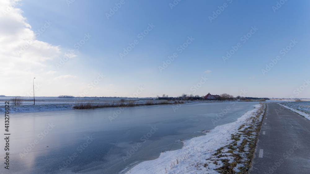 Frozen Holendrecht river in the winter