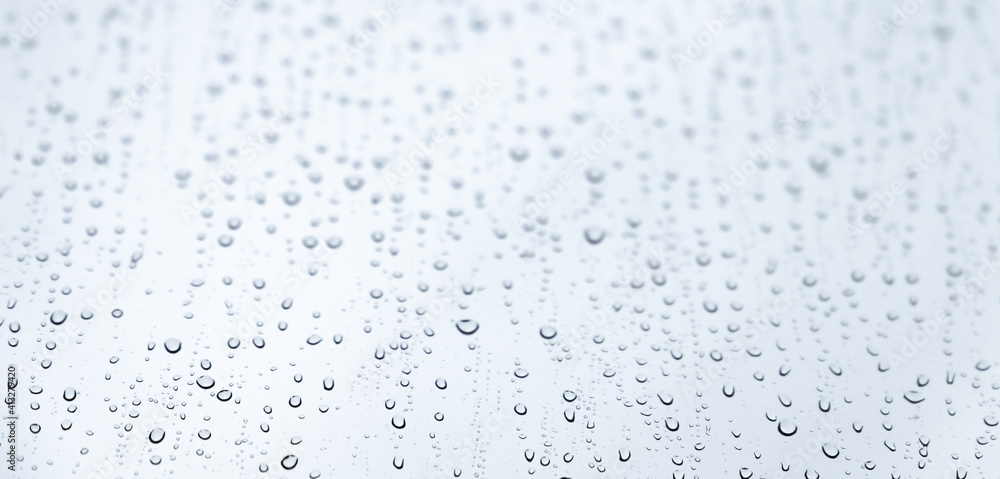Water drops are on glass, background photo Water drops are on glass, background photo