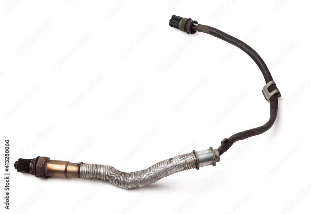 Lambda probe - oxygen sensor device designed to record tamount of remaining oxygen in the exhaust gas of car engine is located in exhaust system. Metal spare part for replacement to repair in workshop Lambda probe - oxygen sensor device designed to record tamount of remaining oxygen in the exhaust gas of car engine is located in exhaust system. Metal spare part for replacement to repair in workshop