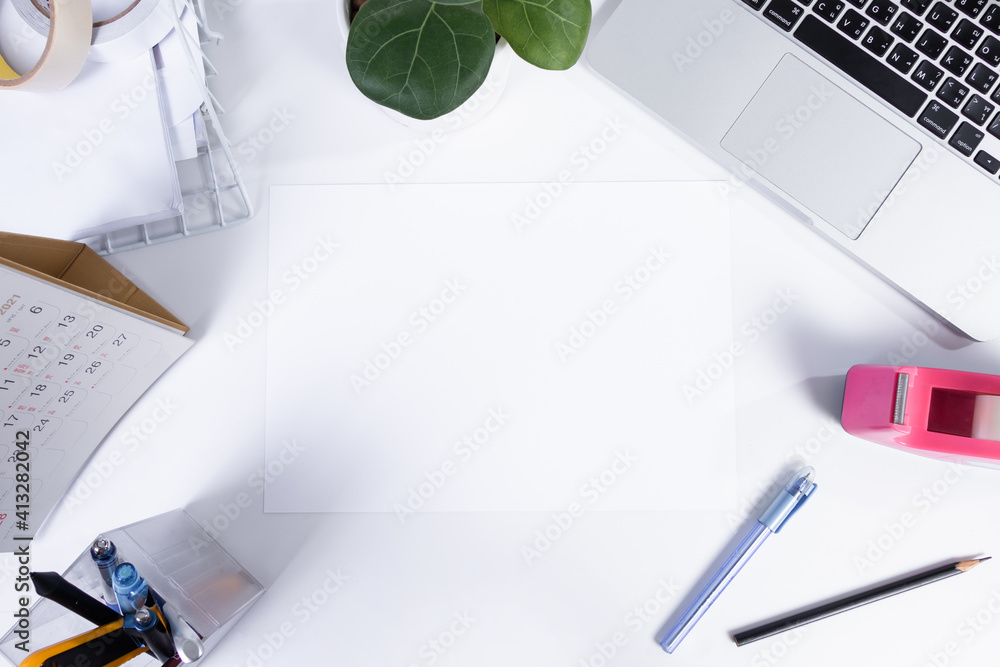 Top view office table desk and workspace with blank on white background.