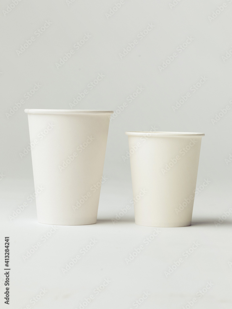 Coffee cup set - mockup template for cafes, design of the restaurant's corporate style. White cardboard coffee cup mockup. Template disposable plastic and paperware for hot drinks Coffee cup set - mockup template for cafes, design of the restaurant's corporate style. White cardboard coffee cup mockup. Template disposable plastic and paperware for hot drinks
