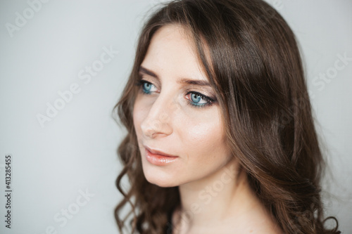 portrait of a white girl with crystal blue eyes and medium brown hair