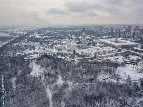 Kiev Pechersk Lavra, covered with snow. Cloudy winter morning. Aerial drone view.