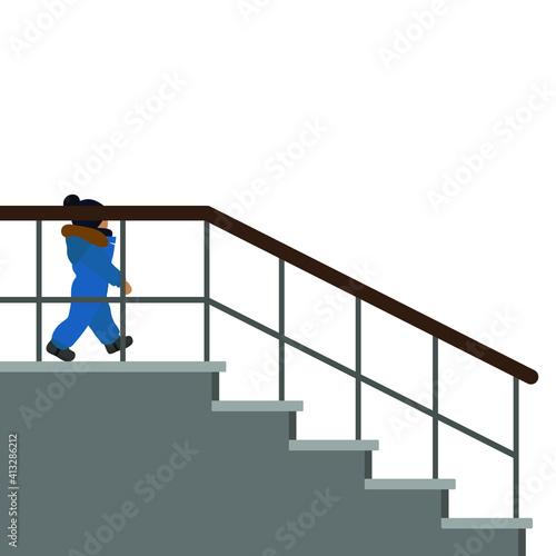 A small child in warm clothes comes down the stairs
