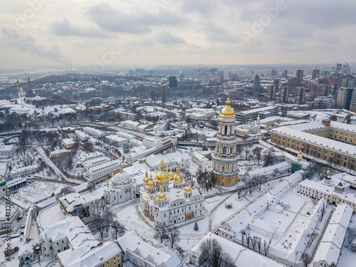 Kiev Pechersk Lavra, covered with snow. Cloudy winter morning. Aerial drone view.