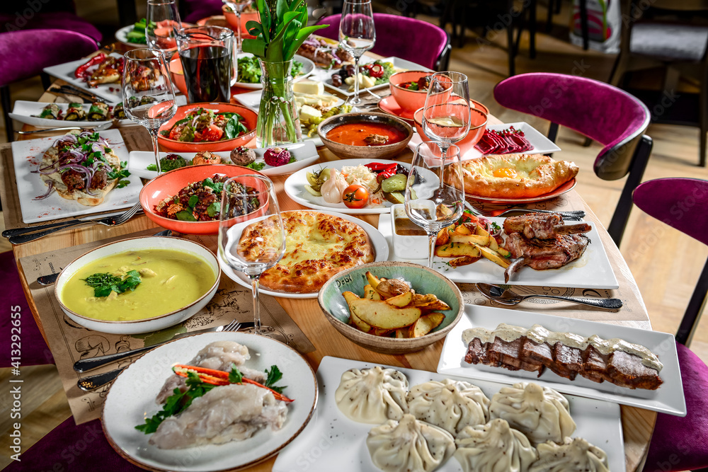 Georgian cuisine. A large laid table of different dishes