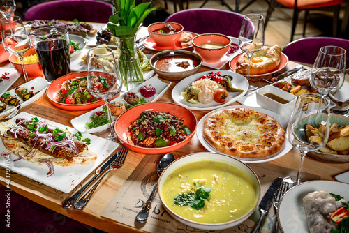 Georgian cuisine. A large laid table of different dishes