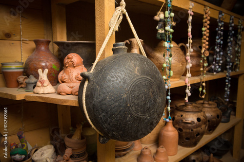 russian traditional pottery on a shelf in a workshop