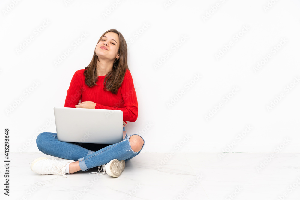 Tenaager girl working with pc isolated on white background smiling a lot Tenaager girl working with pc isolated on white background smiling a lot