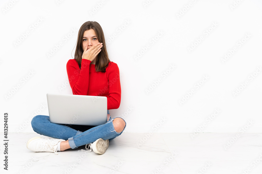 Tenaager girl working with pc isolated on white background covering mouth with hands Tenaager girl working with pc isolated on white background covering mouth with hands