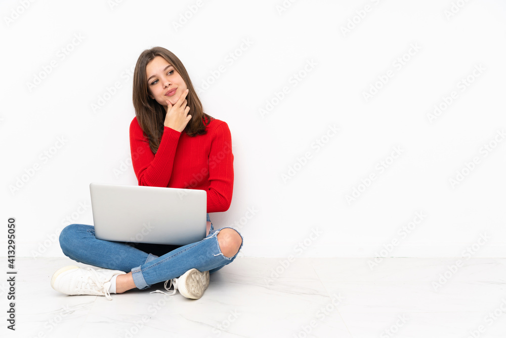 Tenaager girl working with pc isolated on white background smiling Tenaager girl working with pc isolated on white background smiling