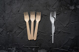 Zero waste concept poster. Reusable wooden cutlery vs plastic cutlery.  Eco friendly zero-waste concept. Top view with space for text. Copy space