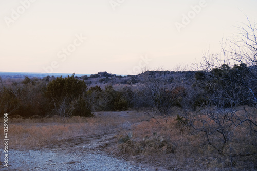 Scenic rural Texas landscape at dusk during winter.