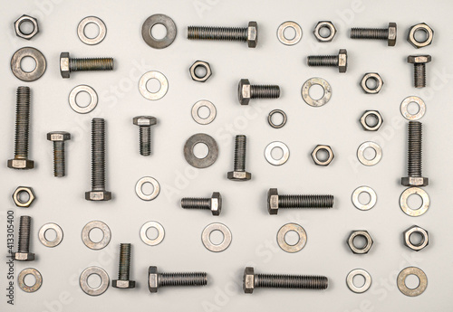 Texture of bolts, nuts, washers on a gray background