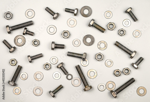 Texture of bolts, nuts, washers on a gray background