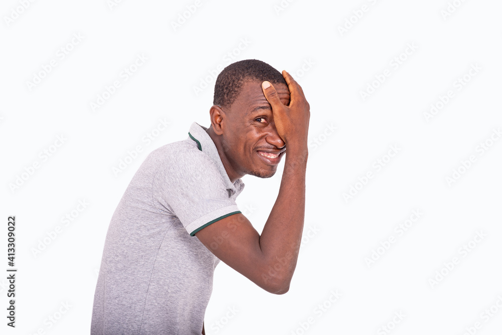 young man covering one eye with hand. young man covering one eye with hand.