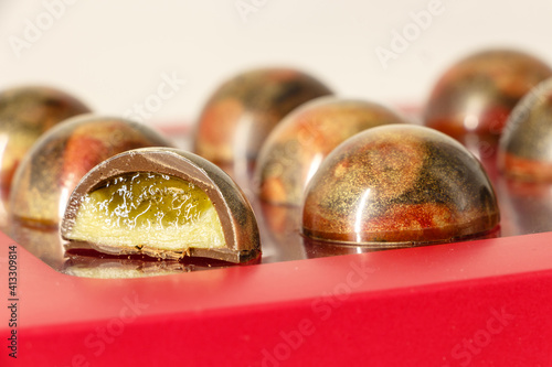 Handmade bonbons made of Belgian chocolate on a red box