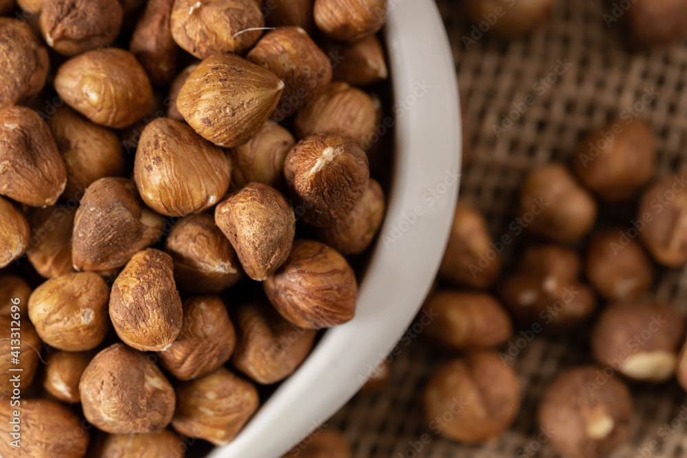 Close up peeled hazelnuts in bowl Close up peeled hazelnuts in bowl
