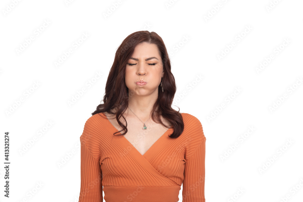a woman on a white background blows her cheeks emotionally and discontentedly a woman on a white background blows her cheeks emotionally and discontentedly