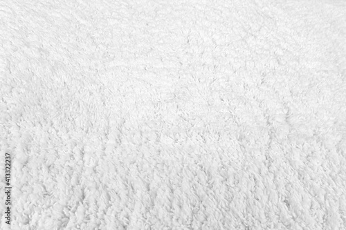 abstract background white fur on a knitted basis close up © Mariia