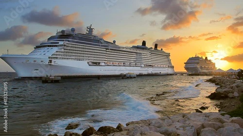 Cruise Ships in port on Caribbean island on sunset. 