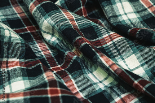 Woolen checkered fabric texture. Warm winter blanket