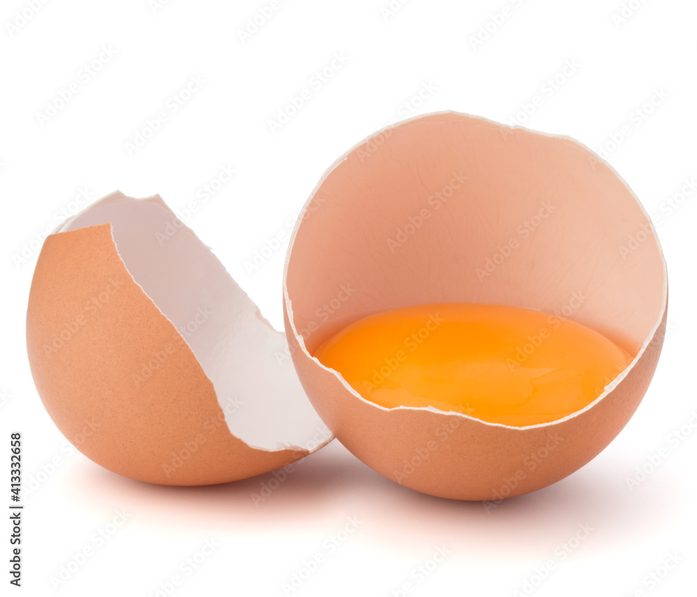 Broken egg in eggshell half isolated on white background cutout Broken egg in eggshell half isolated on white background cutout