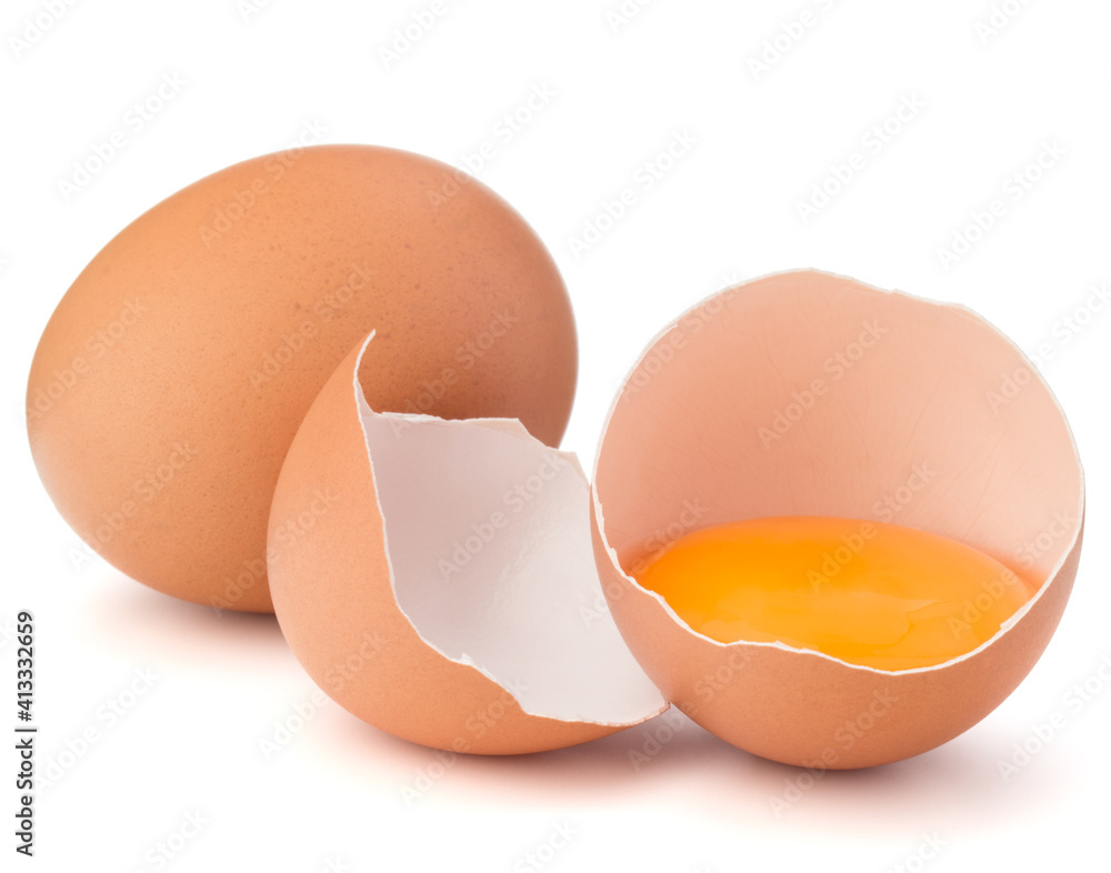 Broken egg in eggshell half and raw egg isolated on white background cutout Broken egg in eggshell half and raw egg isolated on white background cutout