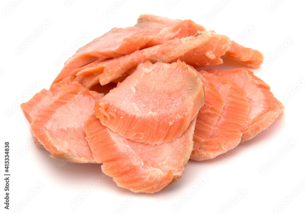 smoked salmon segments isolated on white background cutout. Prepared fish fillet fibres.