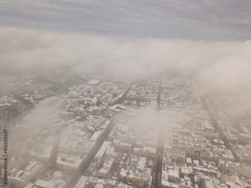 Fog over the snowy Kiev city. Aerial drone view. Foggy winter day. Fog over the snowy Kiev city. Aerial drone view. Foggy winter day.