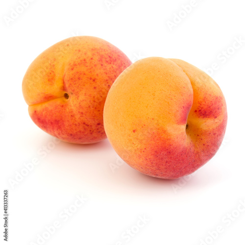 Two apricot fruit isolated on white background cutout