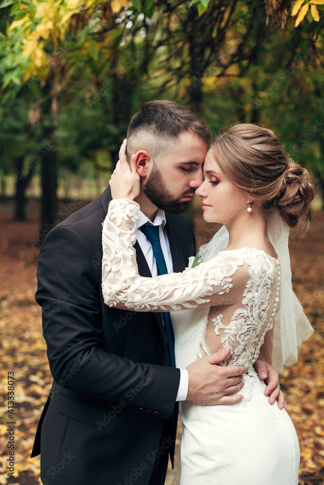 newlyweds walk in the autumn park newlyweds walk in the autumn park