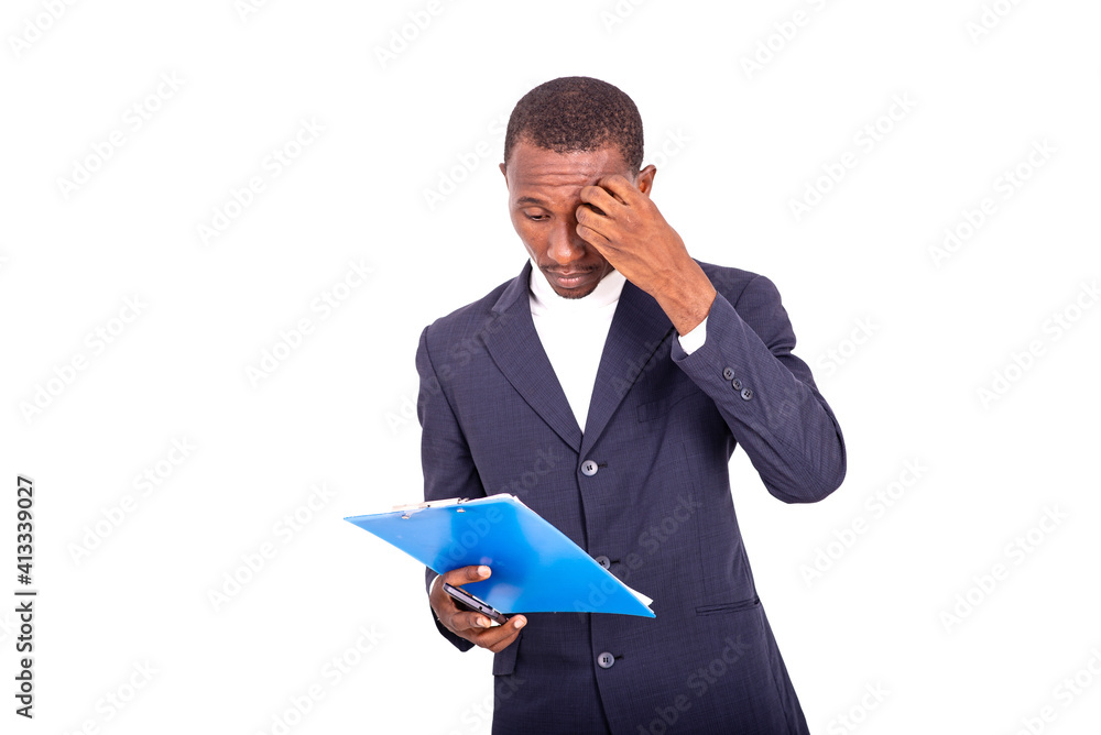 portrait of a handsome businessman with notepad in hand, thoughtful. portrait of a handsome businessman with notepad in hand, thoughtful.