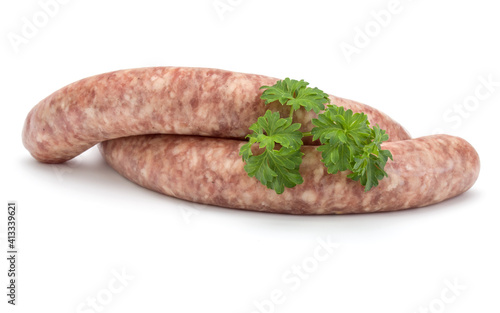 Raw sausage with parsley leaf isolated on white background