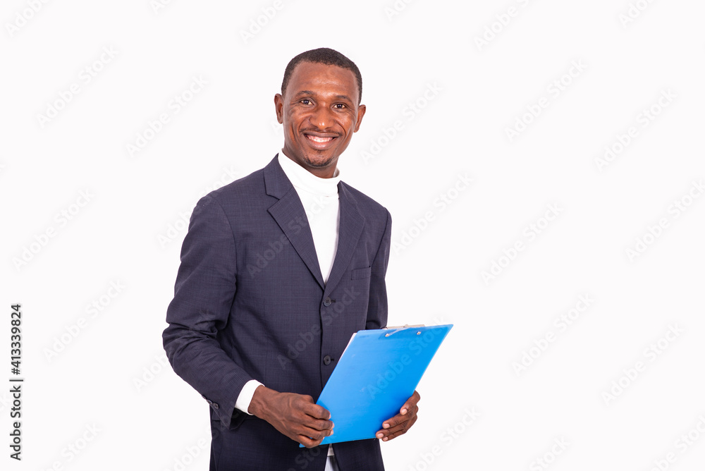 close-up of a handsome businessman with note pad, smiling. close-up of a handsome businessman with note pad, smiling.