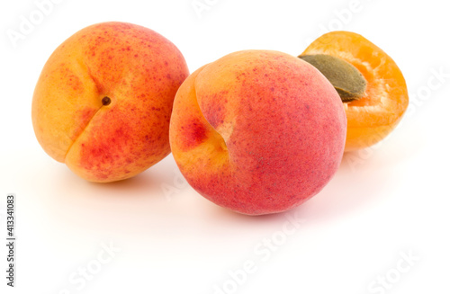 three apricot fruit isolated on white background cutout