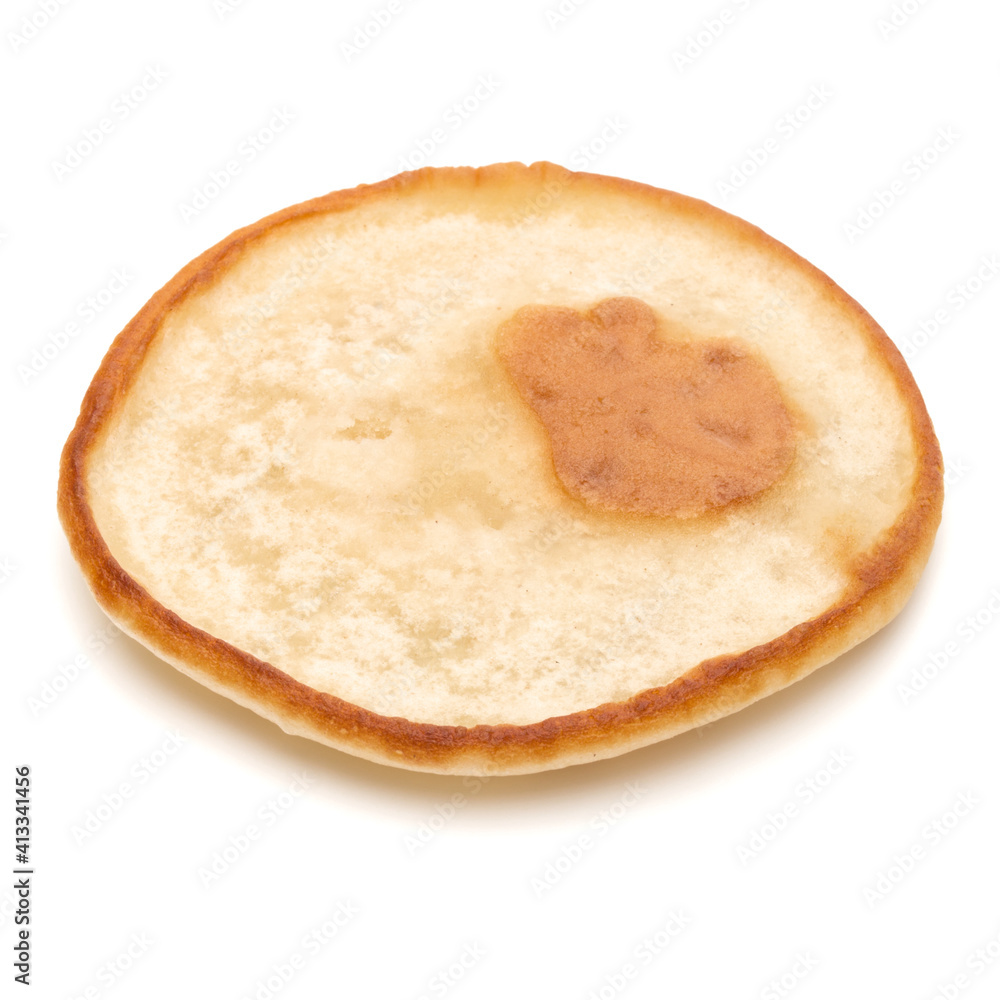One pancake isolated on white background cutout. One pancake isolated on white background cutout.