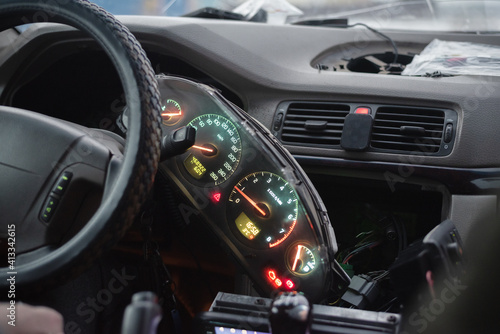 Disassembled car dashboard background close up. © Dmitriy