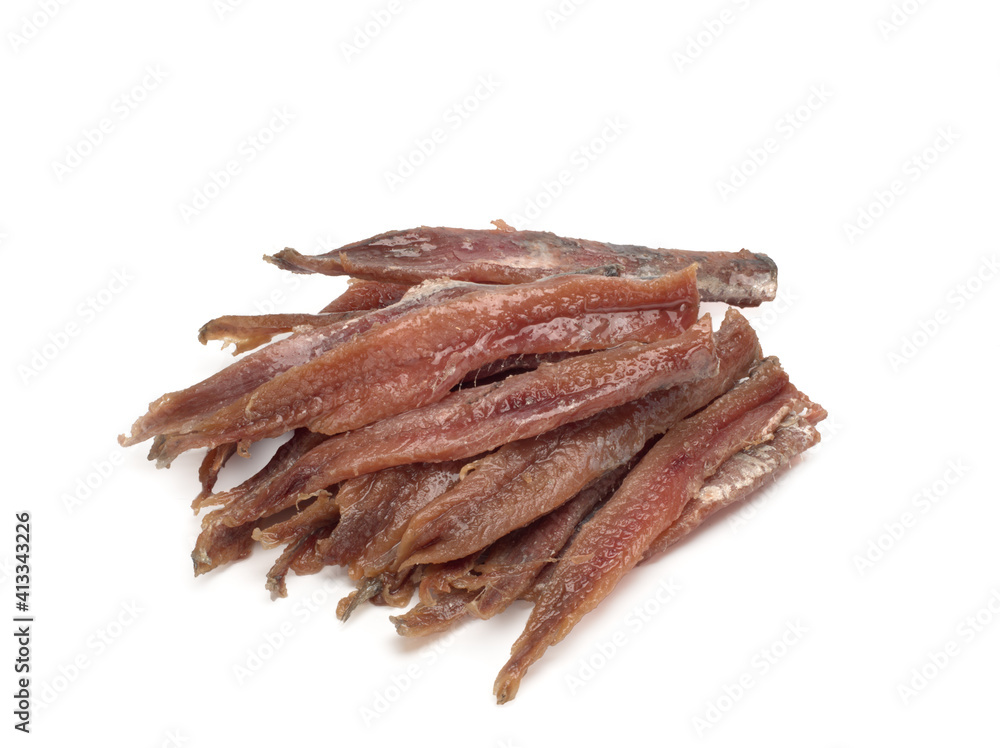 Salted anchovies on a white background. Top view Salted anchovies on a white background. Top view