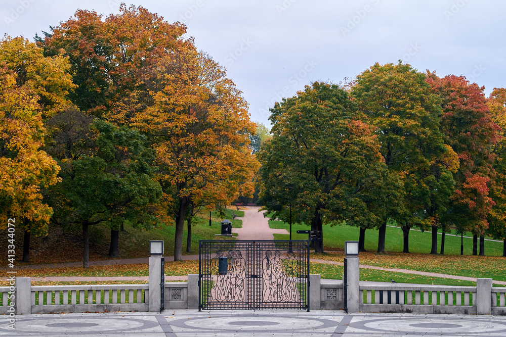 Beautiful, wrought iron gate and colorful foliage in the Frogner Park, Oslo, Norway