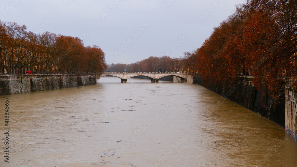 High water level of the Tiber river. Muddy water after heavy rains.