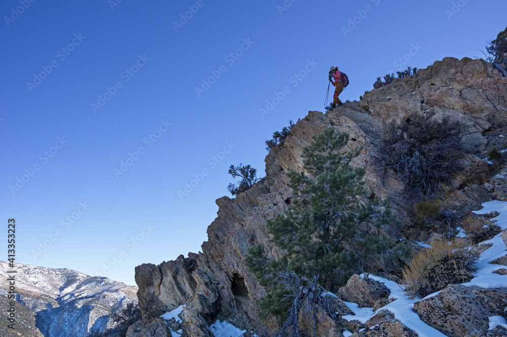 Woman Descending Mountain Ridge